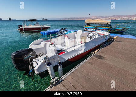 Aqaba, Jordan - November 6, 2017: A tourist boats at the pier in the Gulf of Aqaba in Red Sea, Aqaba, Jordan. Stock Photo