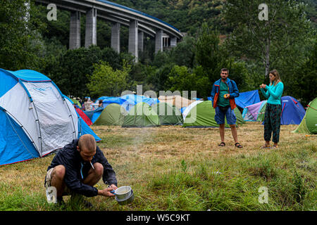 Piedmont, Italy. 27th July, 2019. NO TAV activists gather to protest against the construction of the high-speed train rail link known as TAV, connecting Lyon and Turin, after Prime Minister of Italy, Giuseppe Conte confirmed his support to complete the railway line, in Susa Valley, Piedmont Region, northern Italy 27 July, 2019 Credit: Piero Cruciatti/Alamy Live News