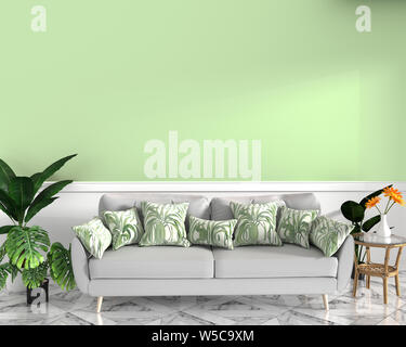 tropical design,armchair,plant,cabinet on granite floor and green background.3 d rendering Stock Photo