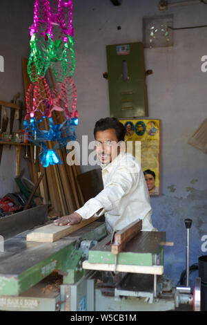Carpenter working in workshop Stock Photo