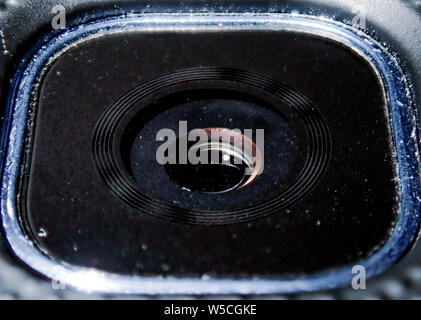 Macro photo of a phone camera / lens with particles effect Stock Photo