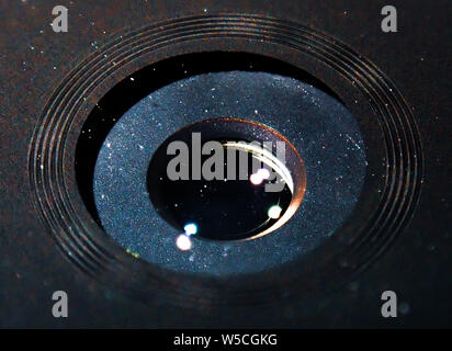 Macro photo of a phone camera / lens with particles effect Stock Photo