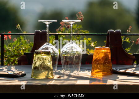 empty glasses standing on a set table in Tuscany Stock Photo