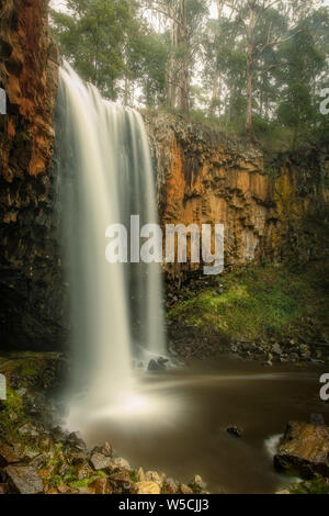 Trentham Falls, one of the longest single drop waterfalls in Victoria, plunging some 32 Metres over ancient basalt columns. Stock Photo