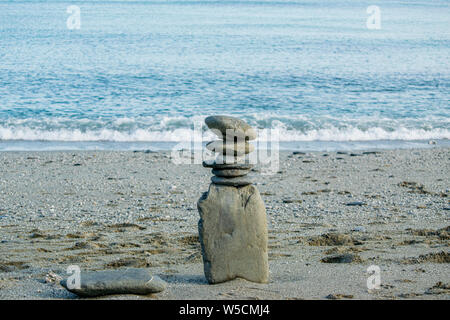 zen balancing rocks on beach Stock Photo