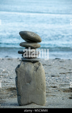 zen balancing rocks on beach Stock Photo