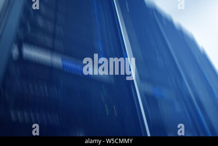 Server Racks In Empty Secure Computer Data Centre. Stock Photo