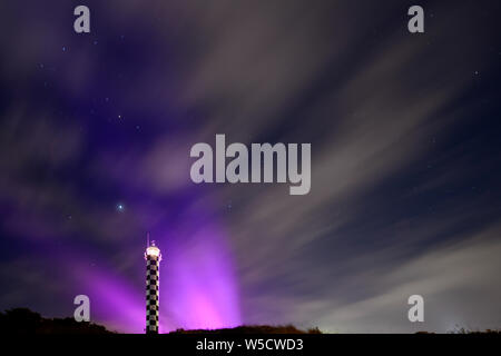 Bunbury Lighthouse at Night Back lit with Stars and Moon Sky Western Australia Stock Photo