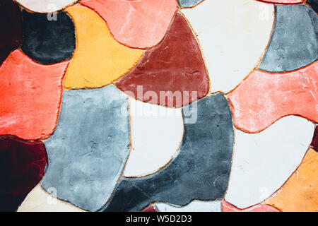 The wall is decorated with colorful patterns. The patterns are painted with paint of different bright colors. Stock Photo