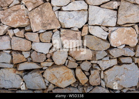 Stone block built wall using random size blocks Stock Photo
