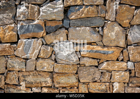 Stone block built wall using random size blocks Stock Photo