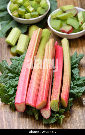 Fresh rhubarb on wooden table Stock Photo