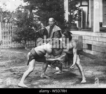 1890s Japan Sumo Wrestlers in Outside Ring Sumo wrestlers in an