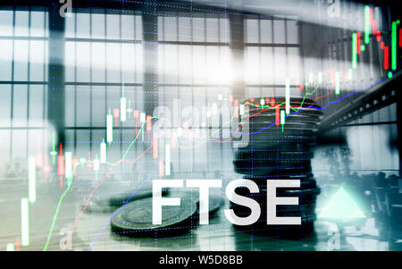 FTSE 100 Financial Times Stock Exchange Index United Kingdom UK England Investment Trading concept with chart and graphs Stock Photo