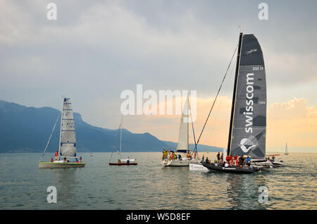 Vevey, Switzerland - July 26 2019: People on sailboats celebrate Fete des Vignerons 2019. Traditional festival pays homage to viticultural traditions in Lavaux wine region. Organized once in 20-25 years, since 18th century. It was honoured as the first living tradition in Switzerland to received UNESCO recognition. Festival takes place from 18th July till 11th August 2019. Stock Photo