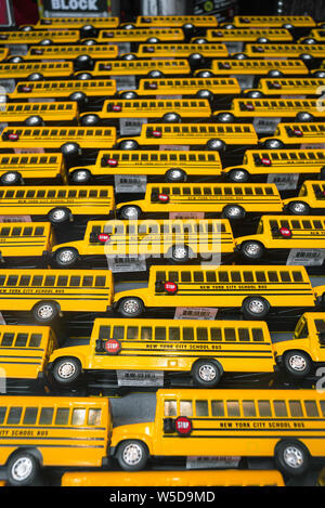 USA education, view of toy yellow school buses on display in a Manhattan shop window, New York City, USA Stock Photo