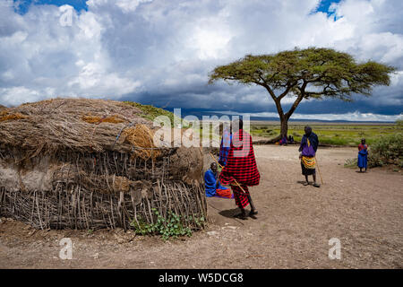 Acacia tree in a Masai Village. Maasai an ethnic group of semi-nomadic people. Photographed in Serengeti, Tanzania Stock Photo