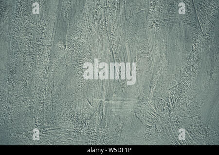 Gray background, grunge concrete wall. Rough scabrous texture. Dirty painted wall. Acrylic paint pattern on card in modern style. Scratched surface. C Stock Photo