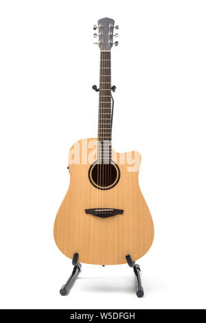 acoustic guitar with stand isolated on white background Stock Photo