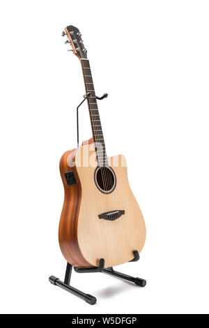 acoustic guitar with stand isolated on white background Stock Photo