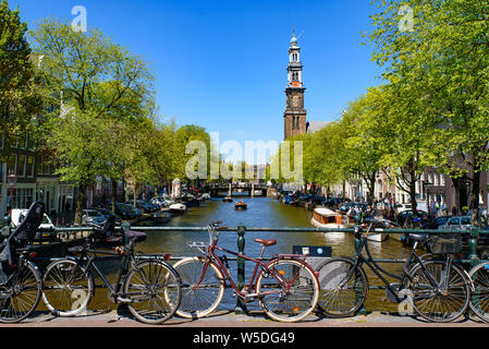 Bikes on the bridge that crosses the canal in Amsterdam, Netherlands Stock Photo