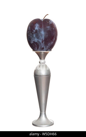 Dark red, purple plum on vase pedestal, isolated on white background. Stock Photo