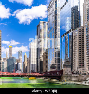 Chicago Skylines building along green dyeing river of Chicago River on St. Patrick day festival in Chicago Downtown IL USA Stock Photo