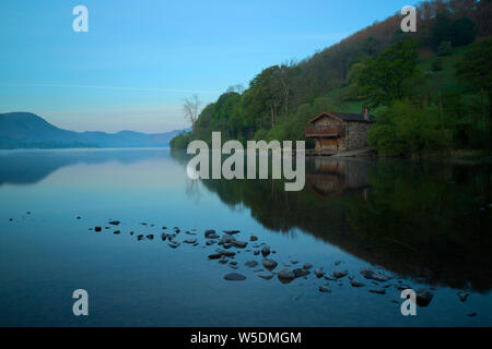 Dawn light breaking over the Duke of Portland Boathouse on Ullswater Stock Photo