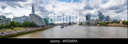 A panoramic view looking west of the London skyline as seen from Tower Bridge including the Shard, the Walkie Talkie and the Gherkin amongst others Stock Photo
