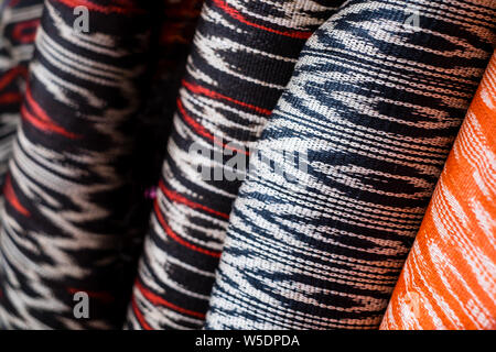 Rolls of hand woven T'nalak cloth, made from organic Abaca plant fibers. Plant based textile. Animal free product. Selective focus. Stock Photo