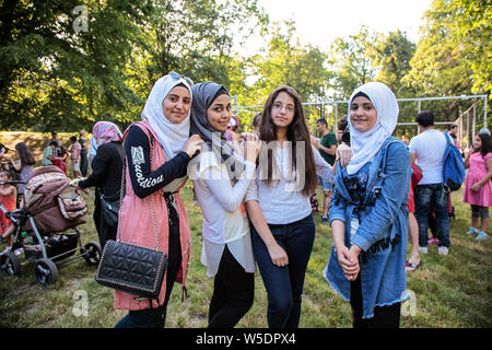 young muslim women standing in  a park, hijab Stock Photo