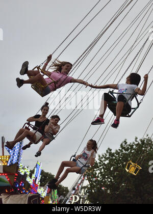 People on a chairoplane ride, Svilajnac, Serbia, Europe Stock Photo