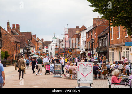 Tourists in  the main shopping street high street in the Warwickshire town of Stratford upon Avon the birthplace of playwright William Shakespeare Stock Photo