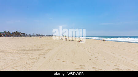 California USA. May 30, 2019. People on sandy Venice beach. Pacific ocean coastline Los Angeles. Blue sky and sea Stock Photo