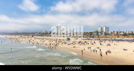 California USA. May 31, 2019. People on sandy Santa Monica beach. Pacific ocean coastline Los Angeles. Blue sky and sea Stock Photo