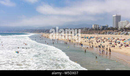 California USA. May 31, 2019. People on sandy Santa Monica beach. Pacific ocean coastline Los Angeles. Blue sky and sea Stock Photo