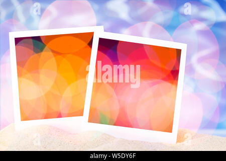 Blank instant images on sand background Stock Photo