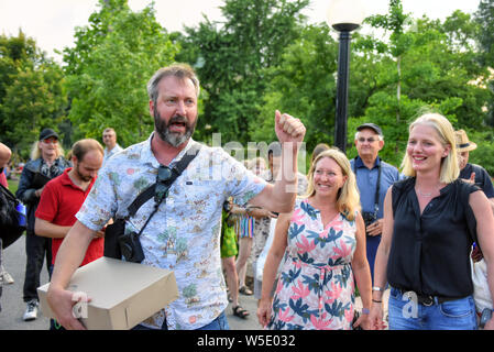 Ottawa, Canada - July 27, 2019:  Ottawa born comedian Tom Green at the rally he invited the public to join in an effort to prevent a proposed addition to the Chateau Laurier that many people feel is not appropriate for the iconic hotel.  On the right are MP Mona Fortier and Environment Minister Catherine McKenna. Stock Photo