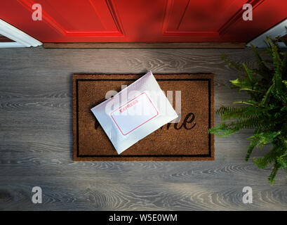 Express courier package delivered outside door. Overhead view. Copy space Stock Photo