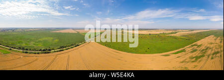 Wide panoramic landscape of farmland, summer time. Aerial view of countryside. Stock Photo