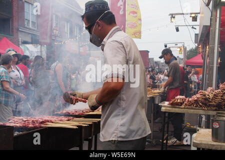 Meat on a stick being grilled at the Ottawa Asian Fest Night Market, 2019. Ottawa, Ontario, Canada. Stock Photo