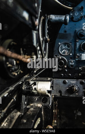 DONCASTER, UK - 28TH JULY 2019: Close up of a planes cockpit showing instruments and panels from an old abandoned two seater plane Stock Photo