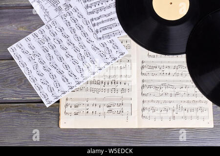 Vinyl records with music sheet scores. Stock Photo