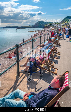 Sidmouth, South Devon, England. Sunday 28th July 2019. UK Weather.  With blue skies and warm sunshine, holidaymakers flock to the south coast town of Stock Photo