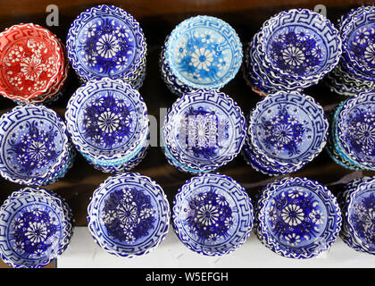 Bowls lined up for sale in a market. Stock Photo