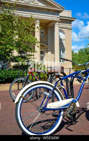 Bicycles on a rack stand before the Fulton Chapel,  the Classical Revival style building, a theatrical venue for the performing arts,  on the campus o Stock Photo