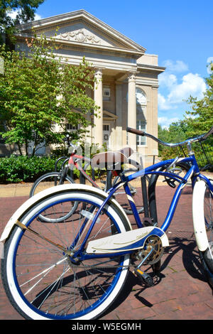 Bicycles on a rack before the Fulton Chapel, a venue for the performing arts, on the campus of Ole Miss, University of Mississippi, Oxford, MS Stock Photo