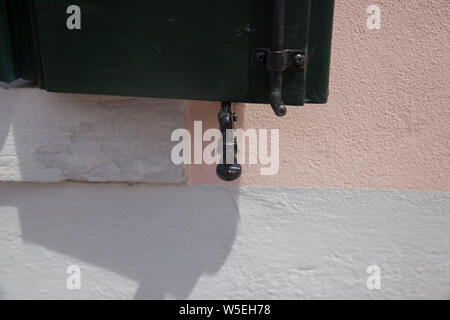 Close up detail shot of old window shutters on buildings in Murano , Venice.A island famous for its glass making. Stock Photo