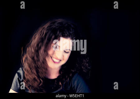 Woman portrait smiling blurred. Stock Photo