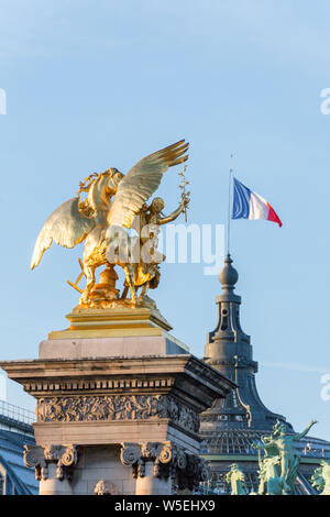 Gilded statue on Pont Alexandre III, Grand Palais behind, Paris, France Stock Photo